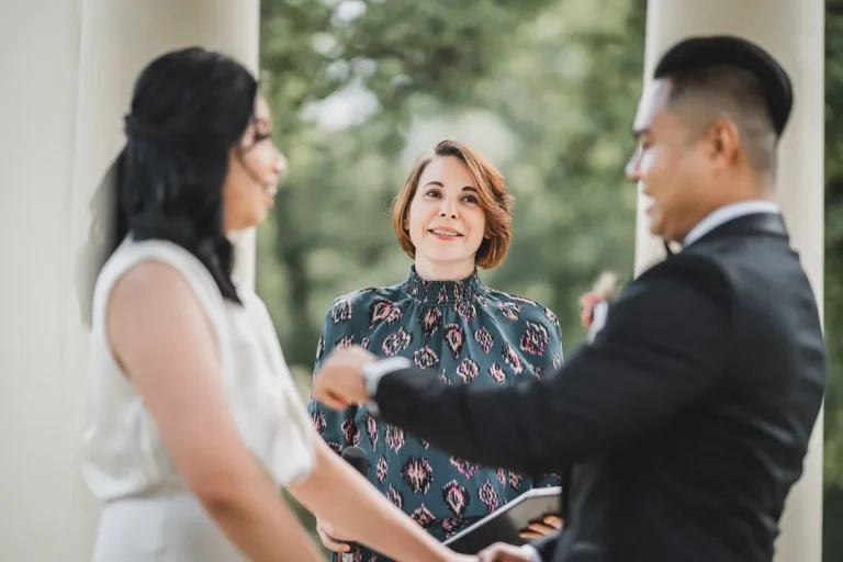 Charis White celebrant officiating wedding ceremony at classic columned venue in Australia