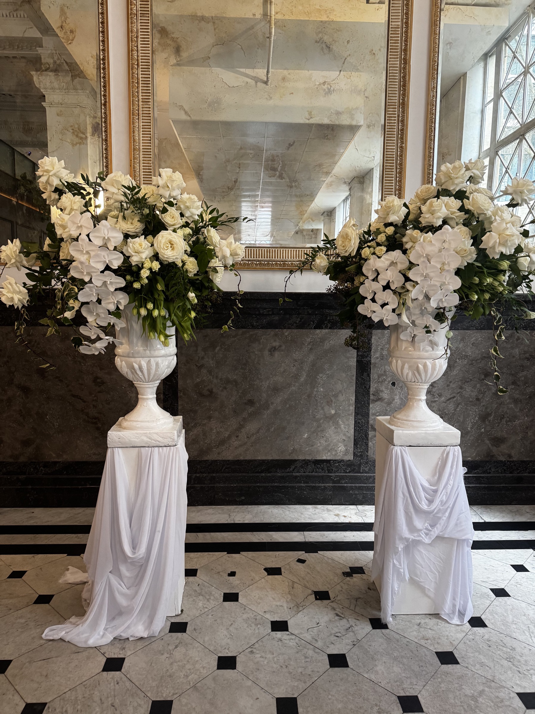 White floral ceremony arrangements inside The Trust Melbourne