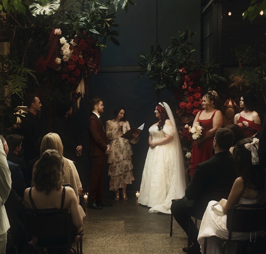 Wedding ceremony and rich red floral styling inside Rupert on Rupert Collingwood